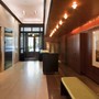Tribeca Lobby - A combination of rich wood, copper leaf, and bronze brings elegance to this space.
